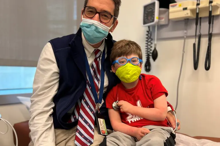 19 of 27, Dr. Adler with boy